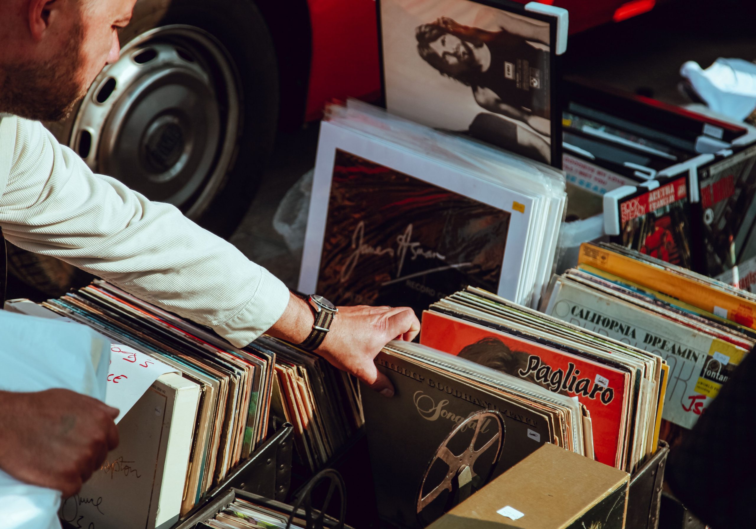 Hand sifting through records at record shop